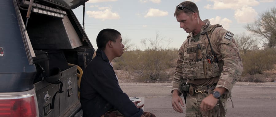 A migrant, left, seeks help in Tucson&#039;s desert in a moment from Netflix&#039;s &quot;Immigration Nation.&quot; (Netflix/TNS)