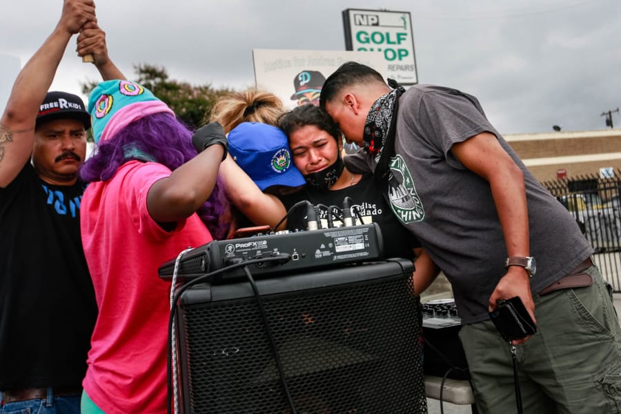 Jennifer Guardado, sister of Andres Guardado, who was fatally shot by a sheriff&#039;s deputy in Gardena, and other relatives of speak at a rally seeking justice for Andres Guardado on Sunday, June 28, 2020 in Gardena, California.