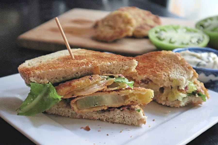 Fried green tomatoes stand in for fresh red tomatoes in this BLT sandwich.
