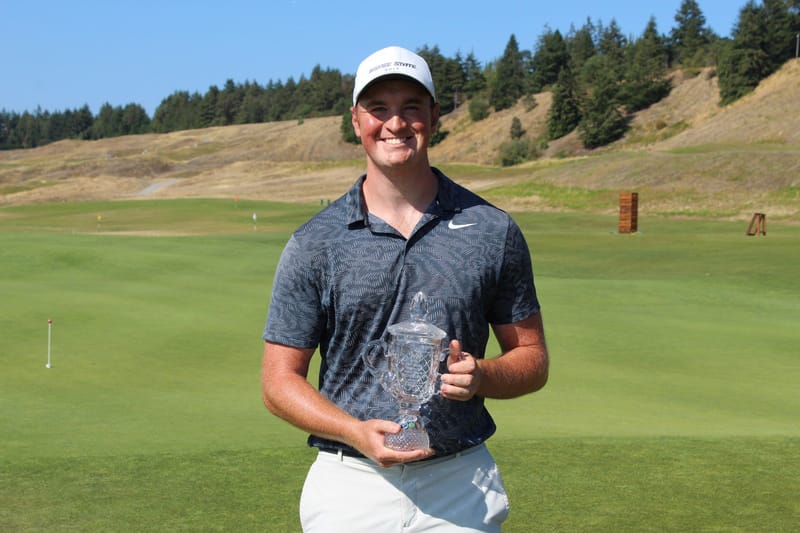 Brian Humphreys of Vancouver holds up the second-place trophy at the Washington Golf Men’s Amateur on Thursday, Aug. 13, 2020.