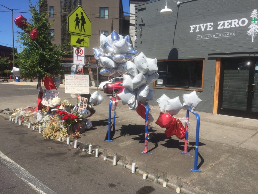 On Northeast Dekum Street, a memorial marks the site where Jordan Lee Louis, 22, was slain on July 28. His death was one of 15 homicides in Portland in July, which was the highest monthly total in 30 years.