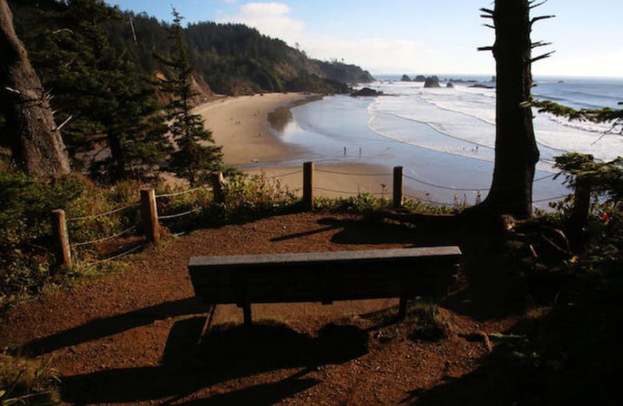 The sun begins to set over Indian Beach at Ecola State Park on the north Oregon Coast.