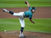 Seattle Mariners pitcher Taylor Williams follows through on a pitch en route to closing out the Texas Rangers on Friday in Seattle. Williams, a Camas High graduate, has converted all six save opportunities so far in the first season with his favorite boyhood club.
