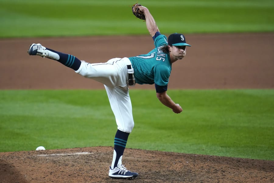 Seattle Mariners pitcher Taylor Williams follows through on a pitch en route to closing out the Texas Rangers on Friday in Seattle. Williams, a Camas High graduate, has converted all six save opportunities so far in the first season with his favorite boyhood club.