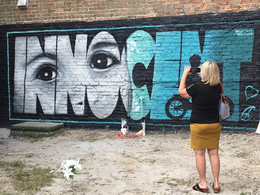 Ruth Godwin visits a mural painted in memory of Cannon Hinnant, a 5-year-old boy from Wilson, N.C., who was shot and killed in his front yard.