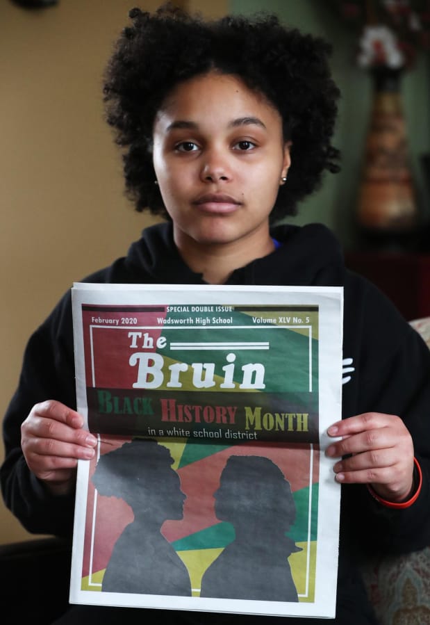 Aniya Harris a senior at Wadsworth High holds a copy of the Wadsworth Bruin, the school&#039;s newspaper, with the cover story on Black History Month in a White School District at her Wadsworth home on Tuesday, Feb. 25, 2020. Harris, who is on the cover as the silhouette on the left, also wrote a column that accompanies the main story.  The district pulled the pulled the issue and reprinted it without the words in a white school district.