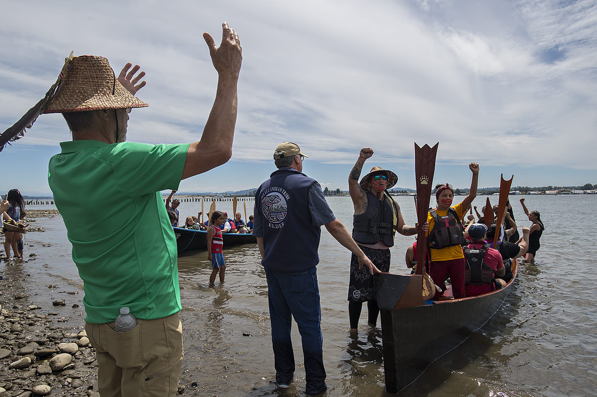 Bill Iyall, left, chairman of the Cowlitz Tribe, welcomes members of the Portland All-Nations canoe family, right, as they arrive at Marine Park along with members of the Cowlitz Tribe, background left, on Friday afternoon, July 12, 2019. Participants, who started in Camas, came out to raise awareness for indigenous missing and murdered women. "We have to have a voice for those who are unable to speak," Iyall said.
