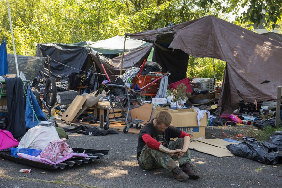 Aaron Anthony Christopher spends a quiet moment at his homeless encampment in northeast Vancouver in July.