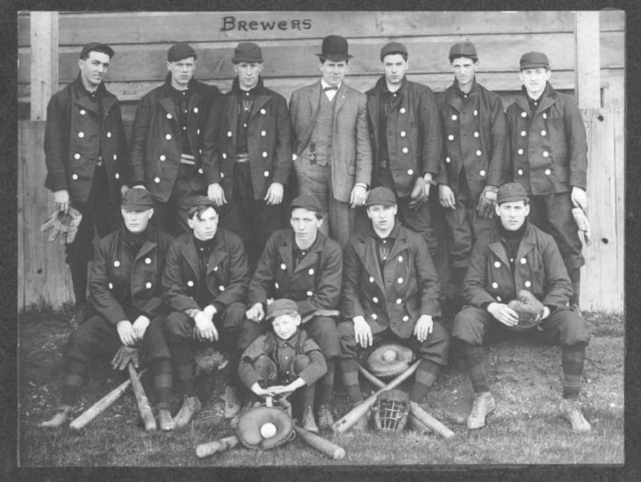 Soldiers at Fort Vancouver played the area&#039;s first baseball games. This undated photo from the early 1900s shows a ball team with &quot;Brewers&quot; in the background.