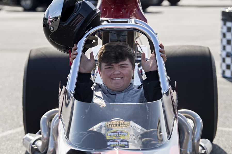 Cooper Chun, 16, of Vancouver pauses for a photo in his 1999 Mullis Rear Engine Dragster at Portland International Raceway on Wednesday evening, August 12, 2020.
