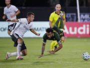 Philadelphia Union defender Kai Wagner, left, and Portland Timbers midfielder Eryk Williamson collide during the first half of an MLS soccer match, Wednesday, Aug. 5, 2020, in Kissimmee, Fla.