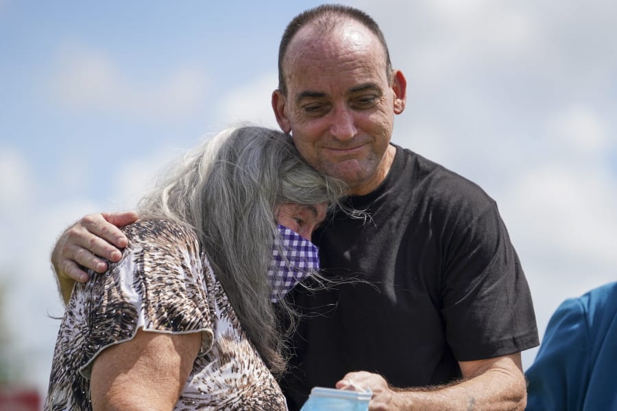 Robert Duboise hugs his mother after being released from prison Thursday, Aug. 27, 2020, in Bowling Green, Fla. Duboise, who spent the last 37 years in prison on a rape and murder charge, was ordered released after officials discovered new evidence that proved his innocence.