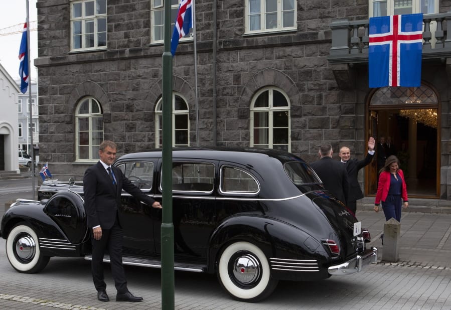 Iceland&#039;s president Gudni Th. Johannesson waves as he gets into a car following his inauguration in Reykjavik, Iceland Saturday Aug. 1, 2020. In Iceland, a nation so safe that its president runs errands on a bicycle, U.S. Ambassador Jeffery Ross Gunter has left locals aghast with his request to hire armed bodyguards.  He&#039;s also enraged lawmakers by casually and groundlessly hitching Iceland to President Donald Trump&#039;s controversial &quot;China virus&quot; label for the coronavirus.