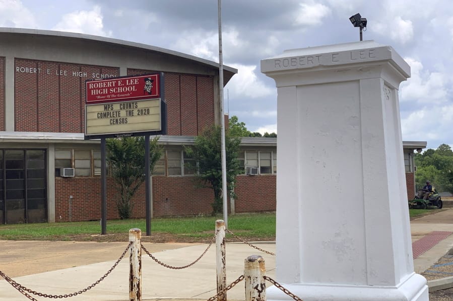 A pedestal that held a statue of Robert E. Lee stands empty outside a high school named for the Confederate general in Montgomery, Ala. on Tuesday, June 2, 2020. Four people were charged with criminal mischief after someone removed the statue amid nationwide protests over the police killing of George Floyd in Minnesota.