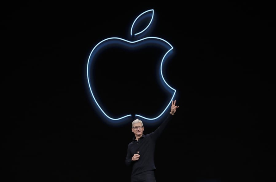 FILE - In this June 3, 2019, file photo, Apple CEO Tim Cook waves after speaking at the Apple Worldwide Developers Conference in San Jose, Calif. Cook has forged his own distinctive legacy. He will mark his ninth anniversary as Apple&#039;s CEO Monday, Aug. 24, 2020 -- the same day the company will split its stock for the second time during his reign.