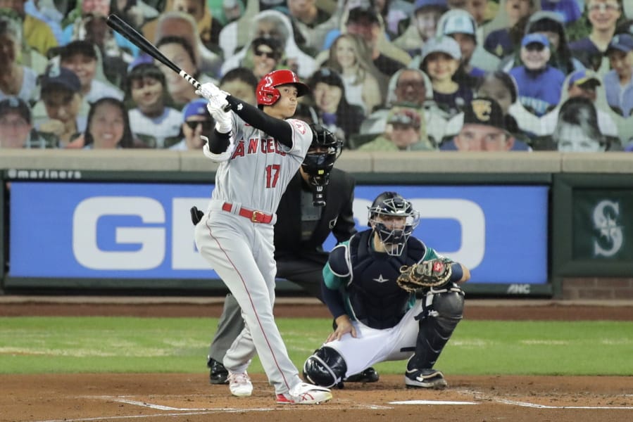 Los Angeles Angels&#039; Shohei Ohtani (17) watches his solo home run as Seattle Mariners catcher Joe Hudson, right, looks on during the second inning of a baseball game Thursday, Aug. 6, 2020, in Seattle. (AP Photo/Ted S.