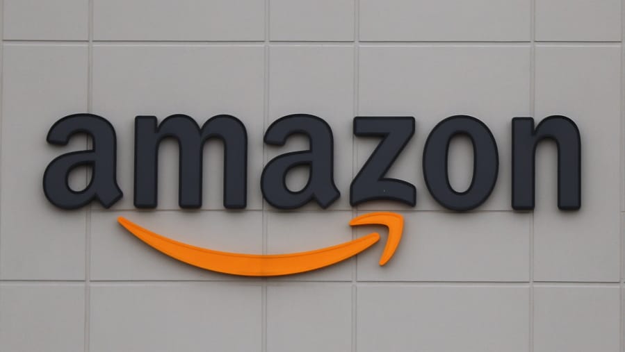 FILE - The Amazon DTW1 fulfillment center is shown in Romulus, Mich., April 1, 2020.  Big Tech companies reported mixed quarterly earnings on Thursday, July 30, 2020, a day after their top executives faced a tough congressional grilling over their market power and alleged monopolistic practices.