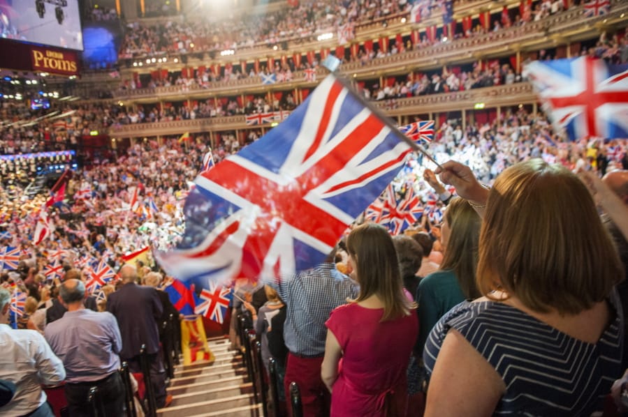 FILE  - In this Sept. 13, 2014 file photo, members of the audience react during the Last Night of the Proms at the Royal Albert Hall, London. The BBC has ditched the lyrics of &quot;Rule Britannia!&quot; for its traditional summer-ending concert amid a controversy over the song&#039;s celebration of the British Empire at a time when critics are re-evaluating the nation&#039;s colonial past. Britain&#039;s publicly funded broadcaster said the final night of its Proms concert series would feature instrumental versions of &quot;Rule Britannia!&quot; and &quot;Land of Hope and Glory,&quot; instead of traditional singalongs.