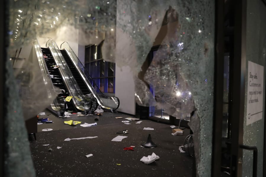 Glass is shattered in the Nordstrom store after a riot occurred in the Gold Coast area of the city early in the morning of Monday, Aug. 10, 2020 in Chicago.  Hundreds of people smashed windows, stole from stores and clashed with police in Chicago&#039;s Magnificent Mile shopping district and other parts of the city&#039;s downtown. (Jose M.