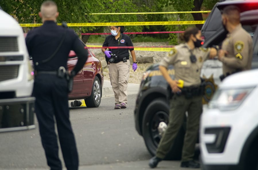 Albuquerque police and Bernalillo County deputies at the scene of a double shooting on the west side of Albuquerque, New Mexico, the result of a confrontation over a mask on Tuesday July 21, 2020.