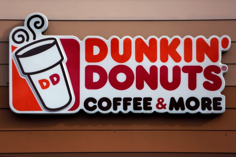 FILE - This Jan. 22, 2018, file photo shows a Dunkin&#039; Donuts logo on a shop in Mount Lebanon, Pa. The Massachusetts-based coffee and donuts empire is teaming with Post Consumer Brands to release two new breakfast cereals based on two of its most popular coffee drinks: Caramel Macchiato and Mocha Latte. The new cereals are expected to hit grocery shelves in late August 2020. (AP Photo/Gene J.