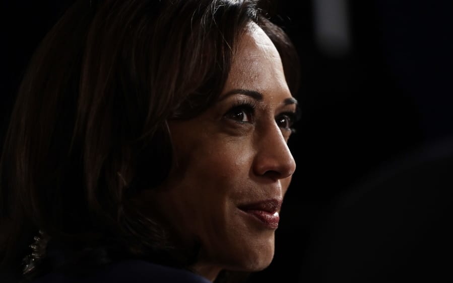 FILE - In this Sept. 12, 2019, file photo Sen. Kamala Harris, D-Calif., talks to the media in the spin room following the Democratic presidential primary debate hosted by ABC on the campus of Texas Southern University in Houston.