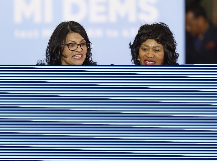 FILE - In an Oct. 26, 2018, file photo, Rashida Tlaib, left, then-Democratic candidate for the Michigan&#039;s 13th Congressional District, and Brenda Jones speak during a rally in Detroit. Tlaib&#039;s approach to governing as an unapologetic fighter, taking aim at the status quo alongside three other first-term congresswomen of color who make up the &quot;squad&quot; has made her a target of the GOP and her own party. Now the Michigan Democrat is the squad&#039;s most vulnerable member, as she faces Detroit City Council President Brenda Jones in the Aug. 4 primary.