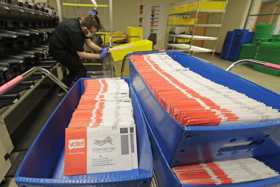 Ballots sit in sorting trays Aug. 5 at the King County Elections headquarters in Renton. (ted s.