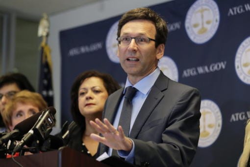 Washington Attorney General Bob Ferguson talks to reporters in August 2019 during a news conference in Seattle.