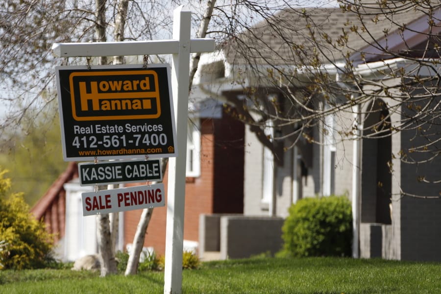 FILE - This Monday, April 27, 2020, file photo shows a sale pending sign on a home in Mount Lebanon, Pa. The coronavirus pandemic helped shape the housing market by influencing everything from the direction of mortgage rates to the inventory of homes on the market to the types of homes in demand and the desired locations. (AP Photo/Gene J.
