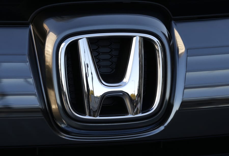 FILE - In this Jan. 11, 2016, file photo, the logo of Honda Motor Co. is seen on a Honda vehicle at the Japanese automaker&#039;s headquarters in Tokyo.  Honda, on Tuesday, Aug. 4, 2020,  is recalling over 1.6 million minivans and SUVs in the U.S. to fix problems that include faulty backup camera displays, malfunctioning dashboard lights and sliding doors that don&#039;t latch properly.  They cover certain Odyssey minivans from 2018 to 2020, Pilot SUVs from 2019 through 2021 and Passport SUVs from 2019 and 2020.