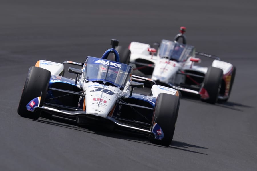 Takuma Sato, of Japan, leads Marco Andretti into turn one during the Indianapolis 500 auto race at Indianapolis Motor Speedway, Sunday, Aug. 23, 2020, in Indianapolis.