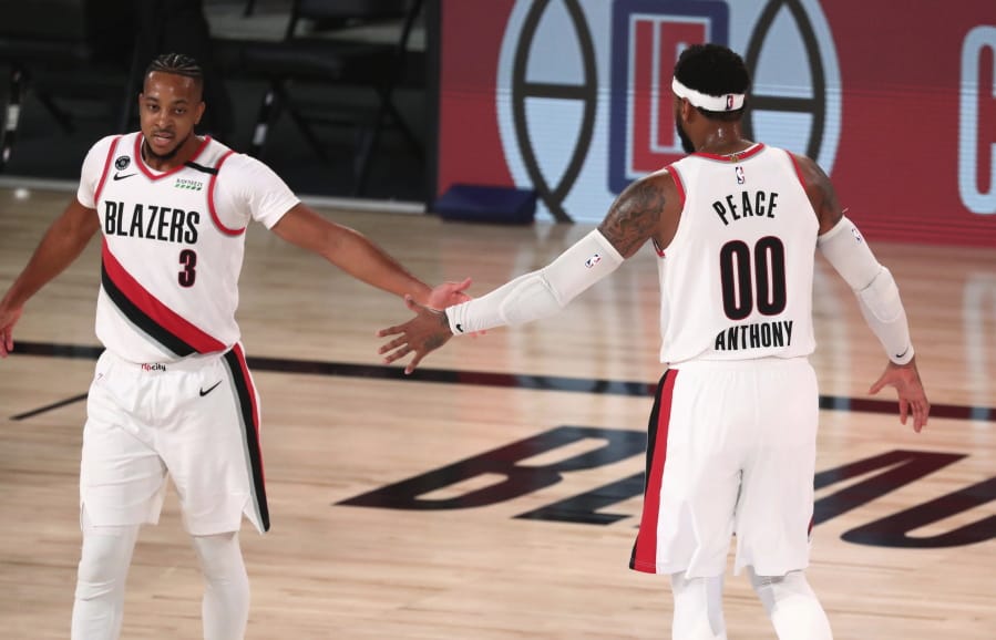 Portland guard CJ McCollum (3) and forward Carmelo Anthony (00) each played key roles in helping the Trail Blazers reach the NBA playoffs for the seventh consecutive season.  The Blazers were a longshot to reach the playoffs, but won seven of nine seeding and play-in games.