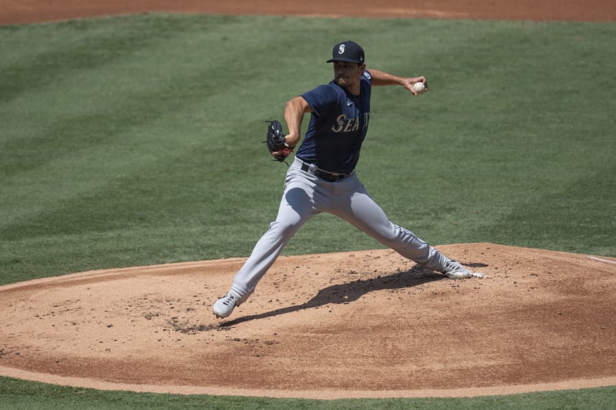 Seattle Mariners starting pitcher Marco Gonzales delivers during the first inning of a baseball game against the Los Angeles Angels in Anaheim, Calif., Monday, Aug. 31, 2020.