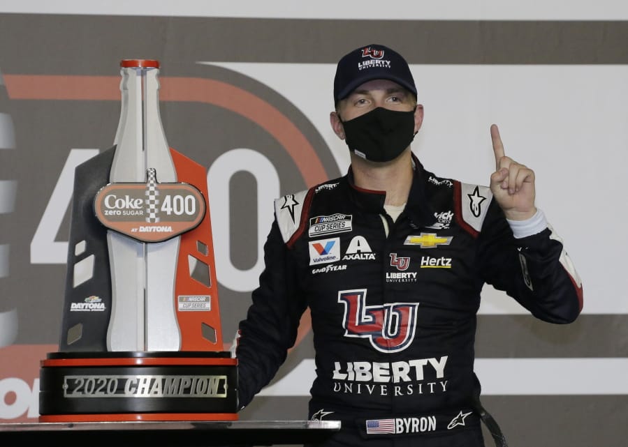 William Byron stands with his trophy in Victory Lane after winning the NASCAR Cup Series auto race at Daytona International Speedway, Saturday, Aug. 29, 2020, in Daytona Beach, Fla.
