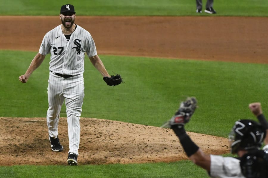Chicago White Sox starting pitcher Lucas Giolito (27) reacts with catcher James McCann after closing out a no-hitter in a baseball game against the Pittsburgh Pirates, Tuesday, Aug. 25, 2020, in Chicago. The White Sox won 4-0.