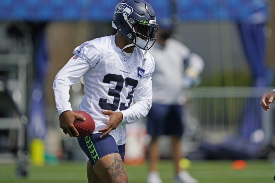 Seattle Seahawks safety Jamal Adams holds the football during a practice drill at NFL football training camp, Wednesday, Aug. 12, 2020, in Renton, Wash. (AP Photo/Ted S.