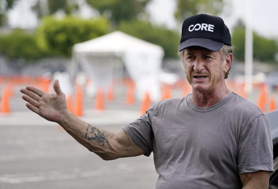 Actor Sean Penn, founder of Community Organized Relief Effort (CORE), is interviewed at a CORE coronavirus testing site at Crenshaw Christian Center, Friday, Aug. 21, 2020, in Los Angeles. Penn says his organization CORE has made some strides against the coronavirus and he&#039;s keeping its mission going by expanding testing and other relief services.