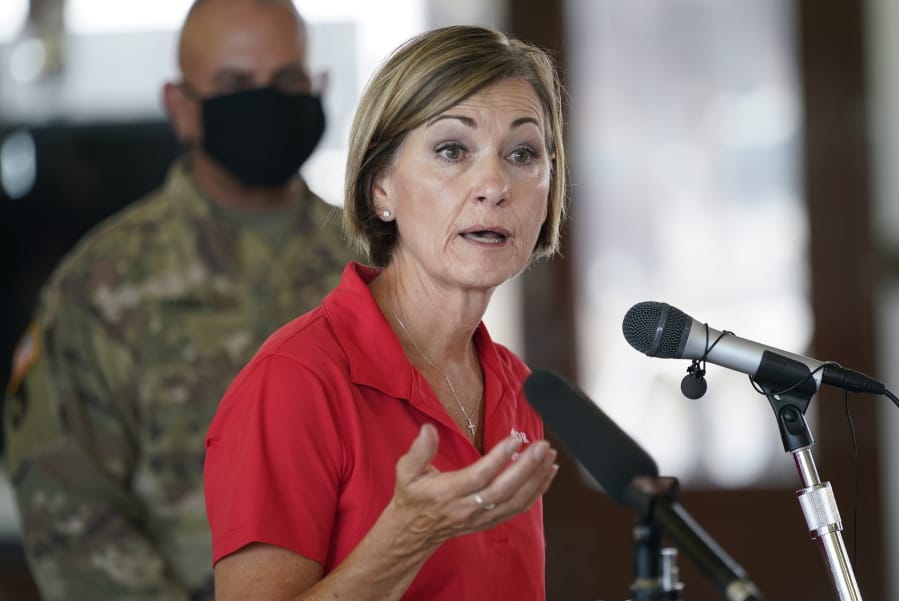Iowa Gov. Kim Reynolds speaks during a news conference, Friday, Aug. 14, 2020, in Cedar Rapids, Iowa. The storm that struck Monday morning left tens of thousands of residents of Iowans without power as of Friday morning.