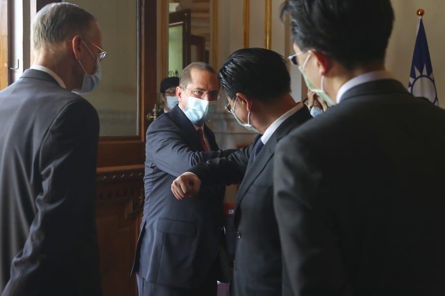 U.S. Health and Human Services Secretary Alex Azar, second from left, is greeted as he arrives at a memorial for former Taiwanese President Lee Teng-hui in Taipei, Taiwan, Wednesday, Aug. 12, 2020. Wednesday is the last day of Azar&#039;s schedule during the highest-level visit by an American Cabinet official since the break in formal diplomatic ties between Washington and Taipei in 1979.