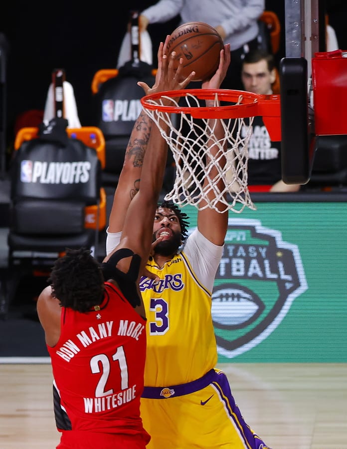 Portland Trail Blazers&#039; Hassan Whiteside (21) blocks a dunk-attempt by Los Angeles Lakers&#039; Anthony Davis (3) during the third quarter of Game 2 of an NBA basketball first-round playoff series, Thursday, Aug. 20, 2020, in Lake Buena Vista, Fla. (Kevin C.