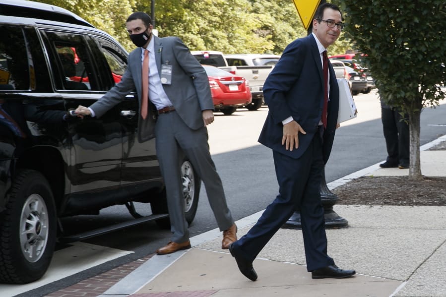 Treasury Secretary Steven Mnuchin arrives for continued negotiations ahead of a meeting, Wednesday, Aug. 5, 2020, on Capitol Hill in Washington.