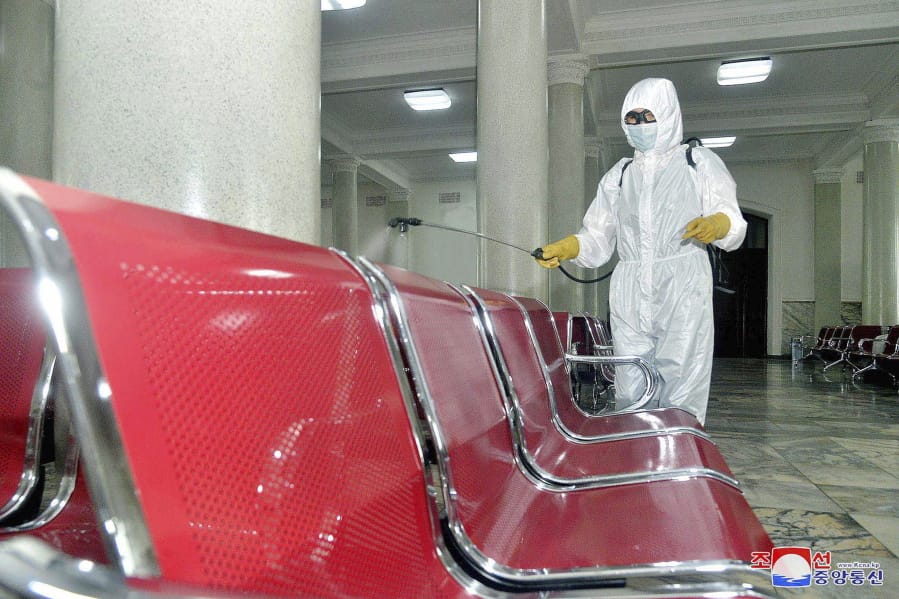 In this undated photo provided on Saturday, Aug. 29, 2020, by the North Korean government, an employee disinfects the inside of Pyongyang Station to protect against the coronavirus in Pyongyang, North Korea. Independent journalists were not given access to cover the event depicted in this image distributed by the North Korean government. The content of this image is as provided and cannot be independently verified. Korean language watermark on image as provided by source reads: &quot;KCNA&quot; which is the abbreviation for Korean Central News Agency.