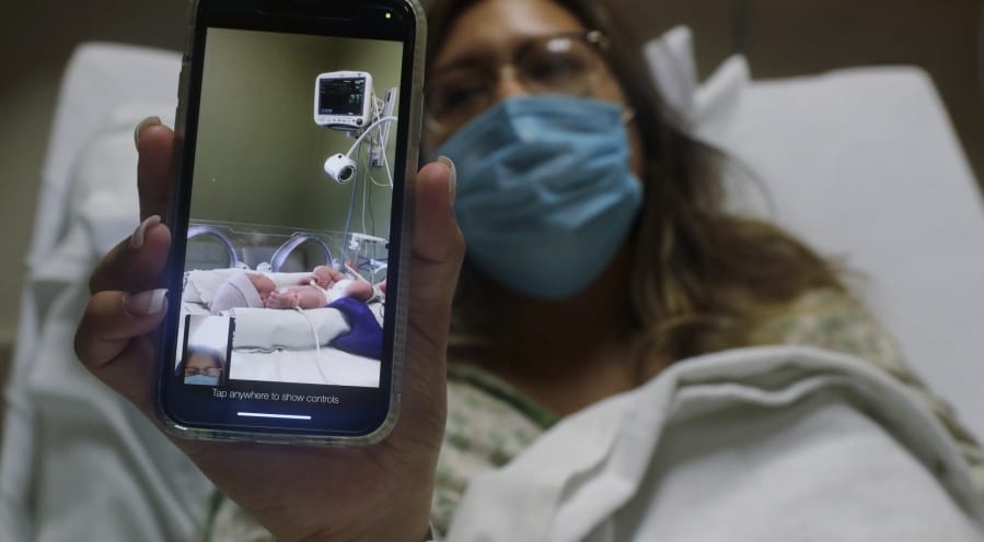 Clarissa Munoz, who is infected with COVID-19, shares a photo of her baby at DHR Health, Wednesday, July 29, 2020, in McAllen, Texas. Munoz was separated from her child after giving birth.