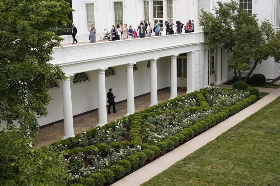 Journalists get an overhead view of the restored Rose Garden at the White House in Washington, Saturday, Aug. 22, 2020. First Lady Melania Trump will deliver her Republican National Convention speech Tuesday night from the garden, famous for its close proximity to the Oval Office. The three weeks of work on the garden, which was done in the spirit of its original 1962 design, were showcased to reporters on Saturday.