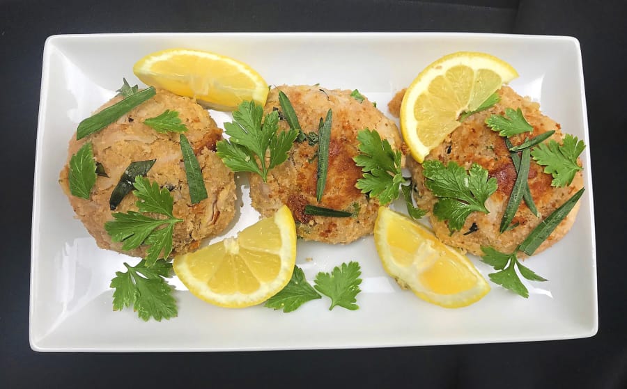 Made with Duke&#039;s mayonnaise, fresh breadcrumbs and tarragon, these crab cakes are delicate, creamy and sweet. They are served with tarragon, parsley and lemon wedges.