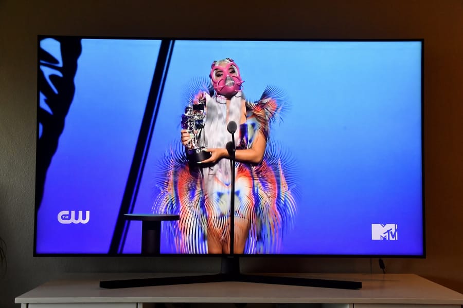 Lady Gaga accepts the Best Collaboration award for &quot;Rain on Me&quot; with Ariana Grande, viewed on a television screen, during the 2020 MTV Video Music Awards broadcast on Sunday in New York City.