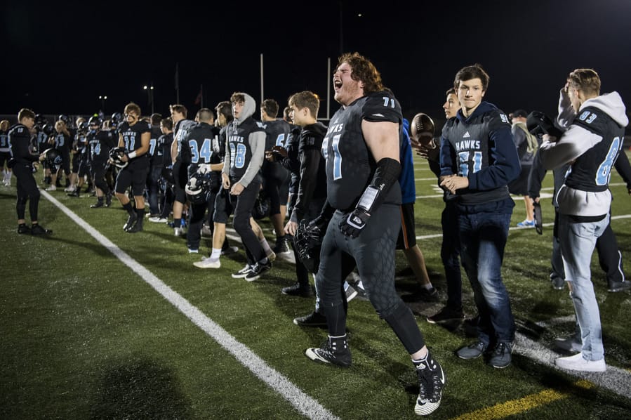 Hockinson&#039;s Nathan Balderas (71) lets out a roar during the 2A state football quarterfinals in 2018. Balderas helped the Hawks win state titles in 2017 and 2018, but was kicked off the team during the 2019 playoffs for disciplinary reasons.