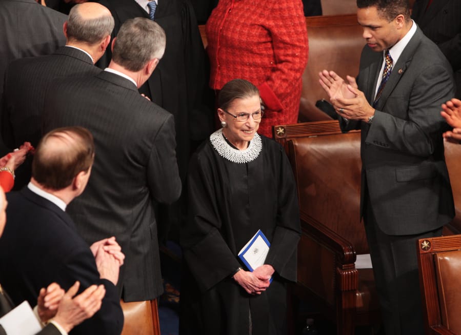 Associate Justice Ruth Bader Ginsburg is cheered as she arrives before President Barack Obama addresses a joint session of Congress on February 24, 2009, in the House of Representatives Chamber in Washington, D.C.