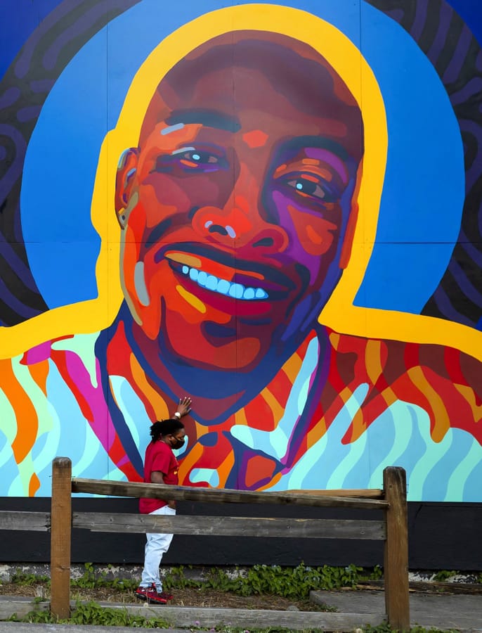 Jeremy Dashiell visits a mural honoring Manuel Ellis in Tacoma.